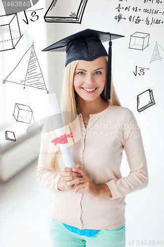 Image of student in graduation cap with certificate