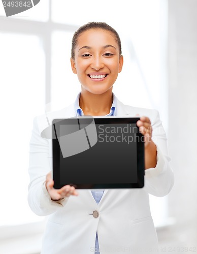 Image of businesswoman with tablet pc in office