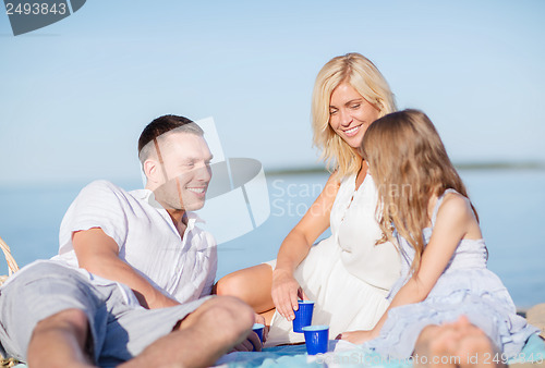 Image of happy family having a picnic