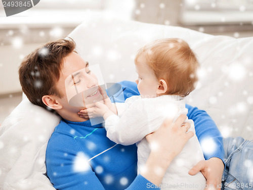 Image of happy father with adorable baby