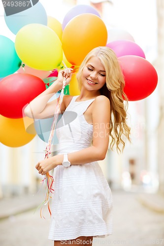 Image of woman with colorful balloons