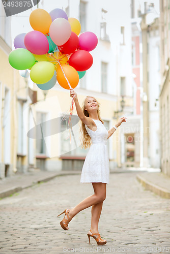 Image of woman with colorful balloons