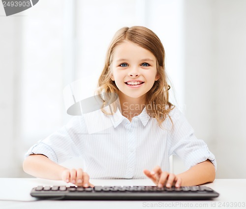 Image of student girl with keyboard