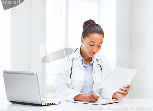 Image of female doctor with laptop pc