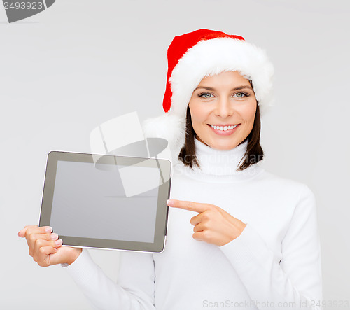 Image of woman in santa helper hat with tablet pc