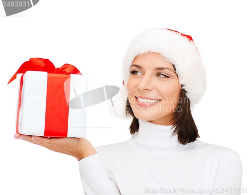 Image of smiling woman in santa helper hat with gift box