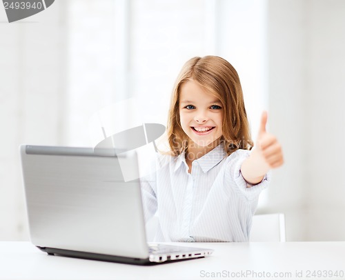 Image of girl with laptop pc at school