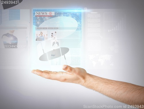 Image of man with virtual screen and news