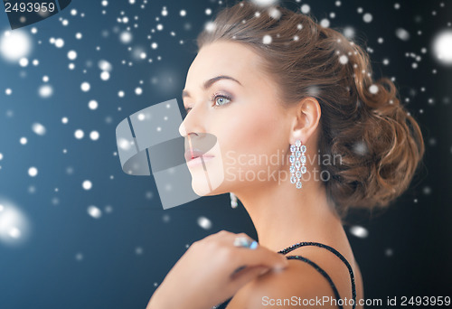 Image of woman with diamond earrings