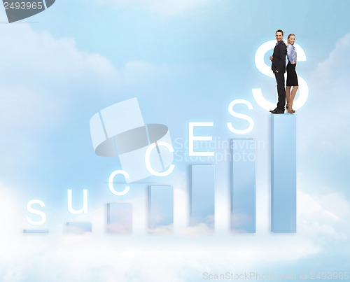 Image of businessman and businesswoman on the top of chart