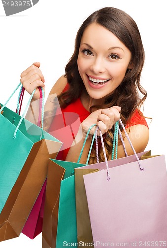 Image of woman in red dress with shopping bags
