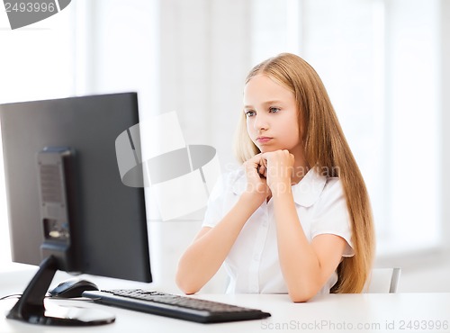 Image of student girl with computer at school