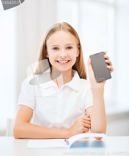 Image of girl with smartphone at school