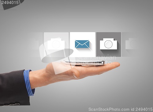 Image of hand with smartphone showing application