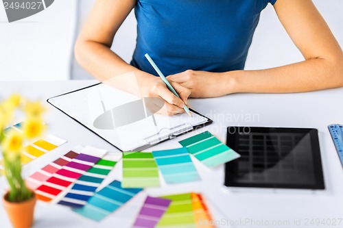 Image of woman working with color samples for selection