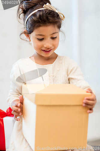 Image of happy child girl with gift box