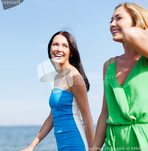 Image of girls walking on the beach