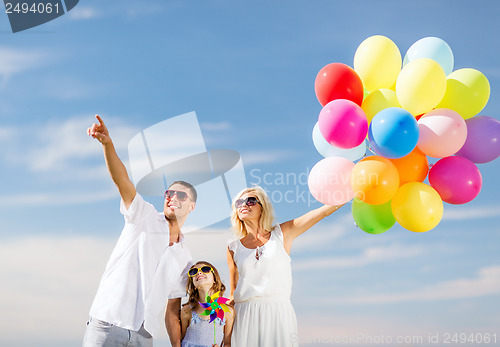 Image of family with colorful balloons