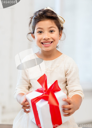 Image of happy child girl with gift box