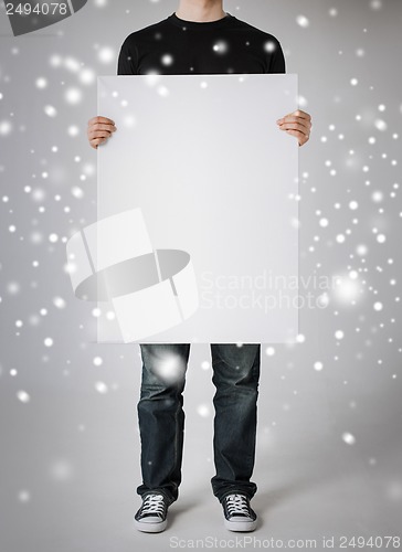 Image of man showing white blank board