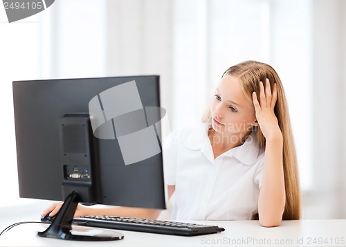 Image of student girl with computer at school