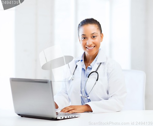 Image of female doctor with laptop pc