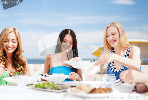 Image of girls in cafe on the beach