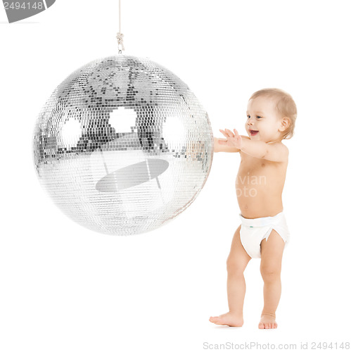 Image of toddler playing with disco ball