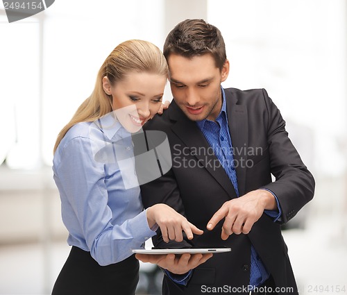 Image of man and woman with tablet pc