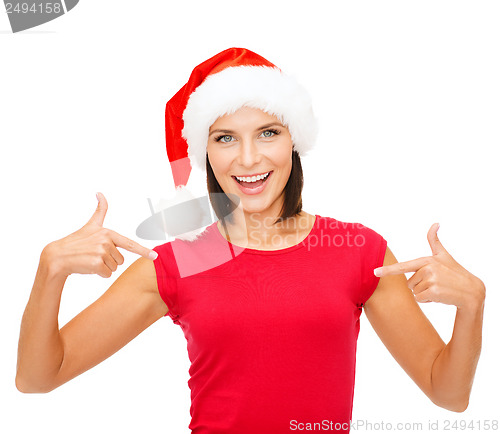 Image of smiling woman in santa helper hat