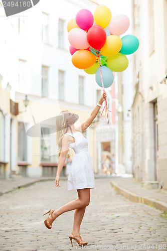 Image of woman with colorful balloons