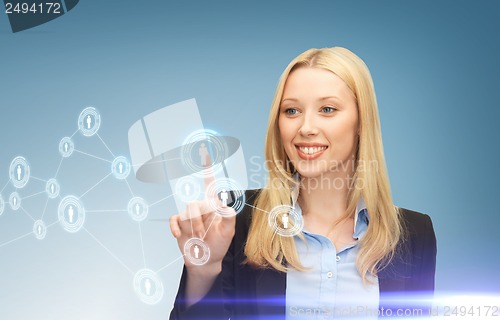 Image of businesswoman pressing button with contact