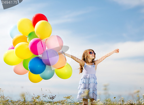 Image of happy girl with colorful balloons