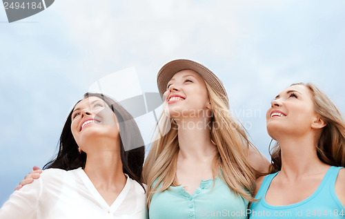 Image of girls looking up in the sky