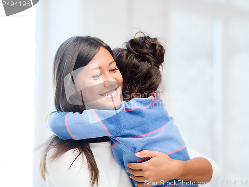 Image of hugging mother and daughter