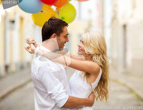 Image of couple with colorful balloons