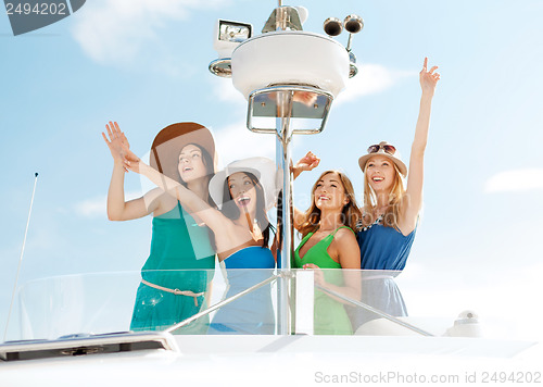 Image of girls waving on boat or yacht