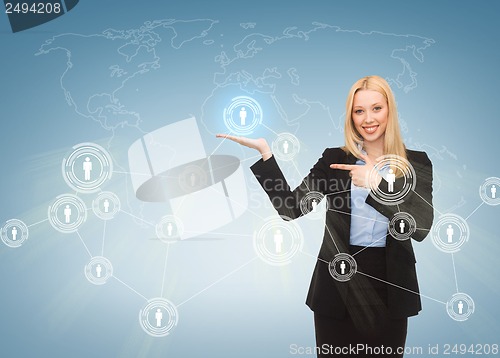 Image of businesswoman pointing at contact icons