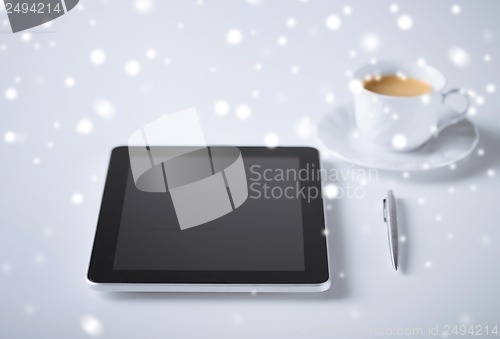 Image of tablet pc with cup of coffee