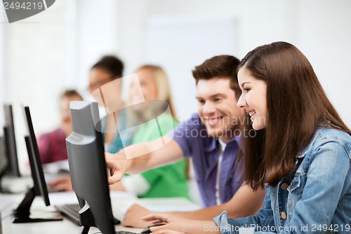 Image of students with computers studying at school