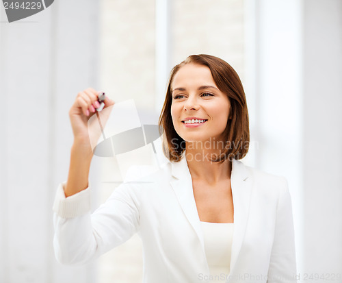 Image of businesswoman writing in the air