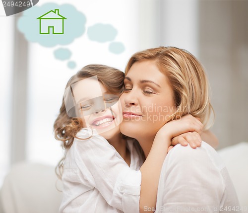 Image of mother and daughter with eco house