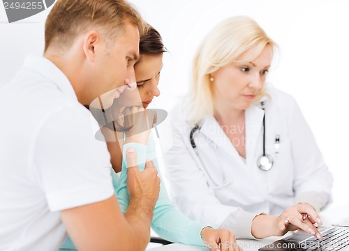 Image of doctor with patients in hospital