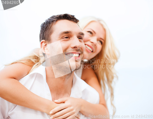 Image of couple having fun on the beach