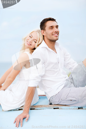 Image of couple in shades at sea side