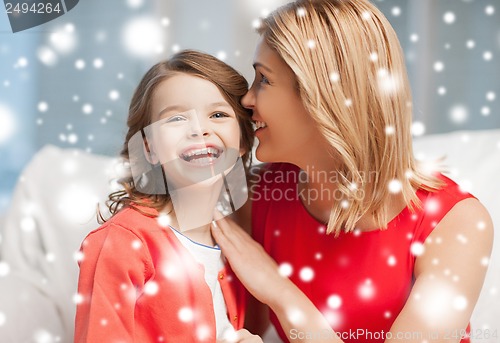 Image of mother and daughter cuddling