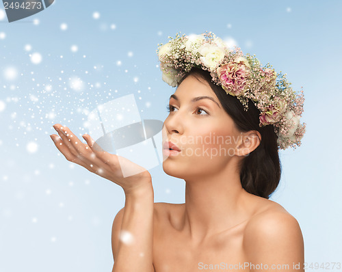 Image of woman wearing wreath of flowers