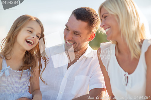 Image of happy family having a picnic