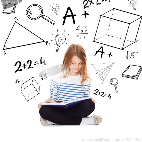 Image of student girl studying and reading book