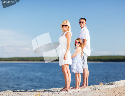 Image of happy family with blue sky